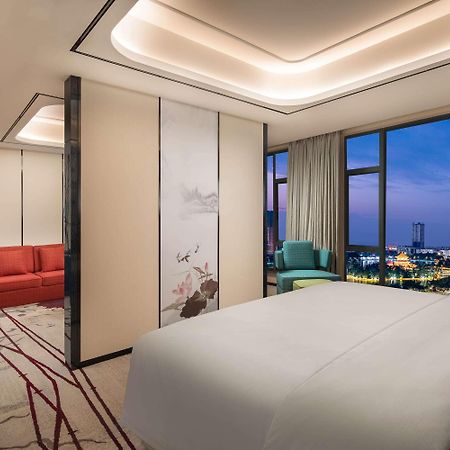Ramada By Wyndham Mengzi Suites Exterior foto