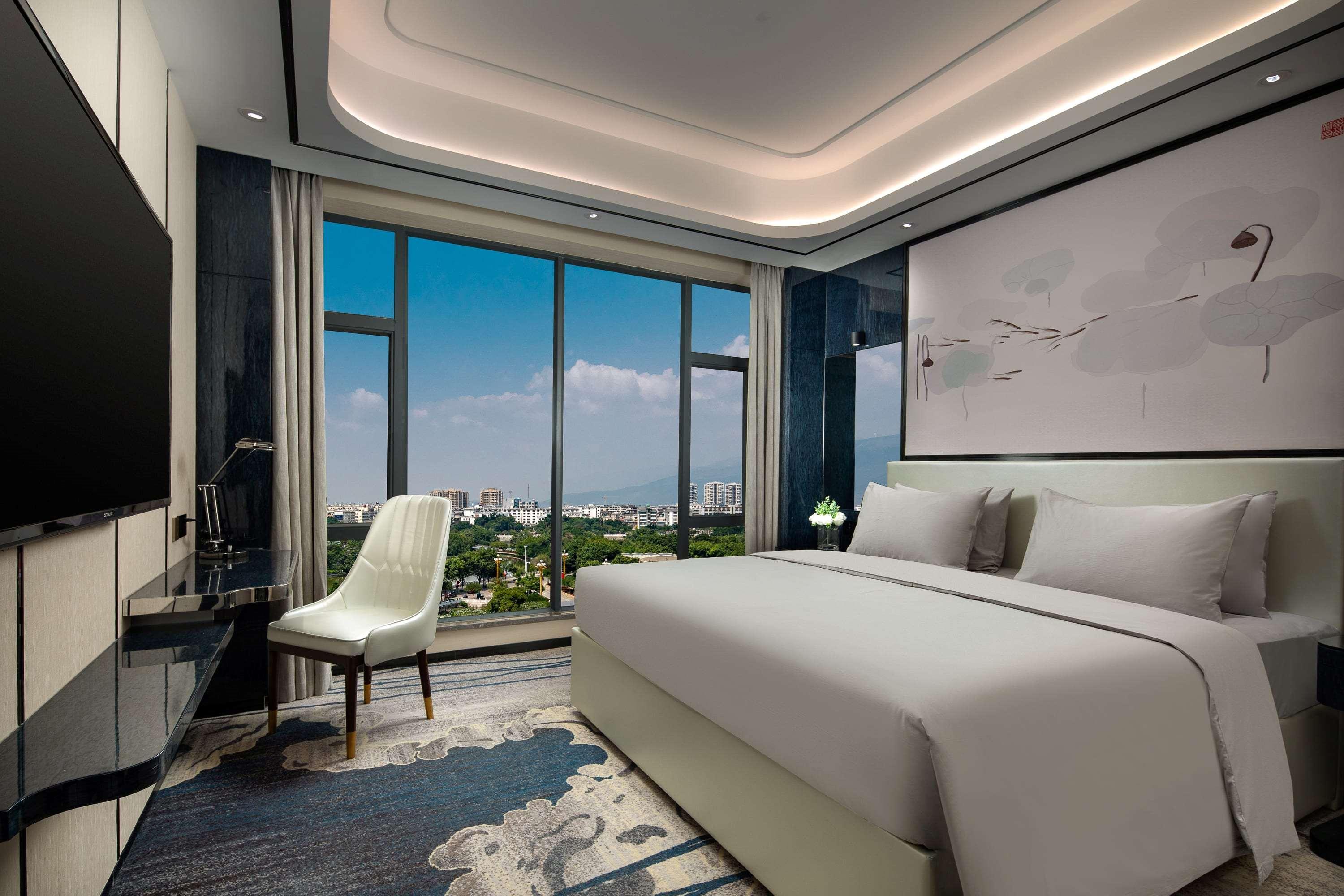 Ramada By Wyndham Mengzi Suites Exterior foto